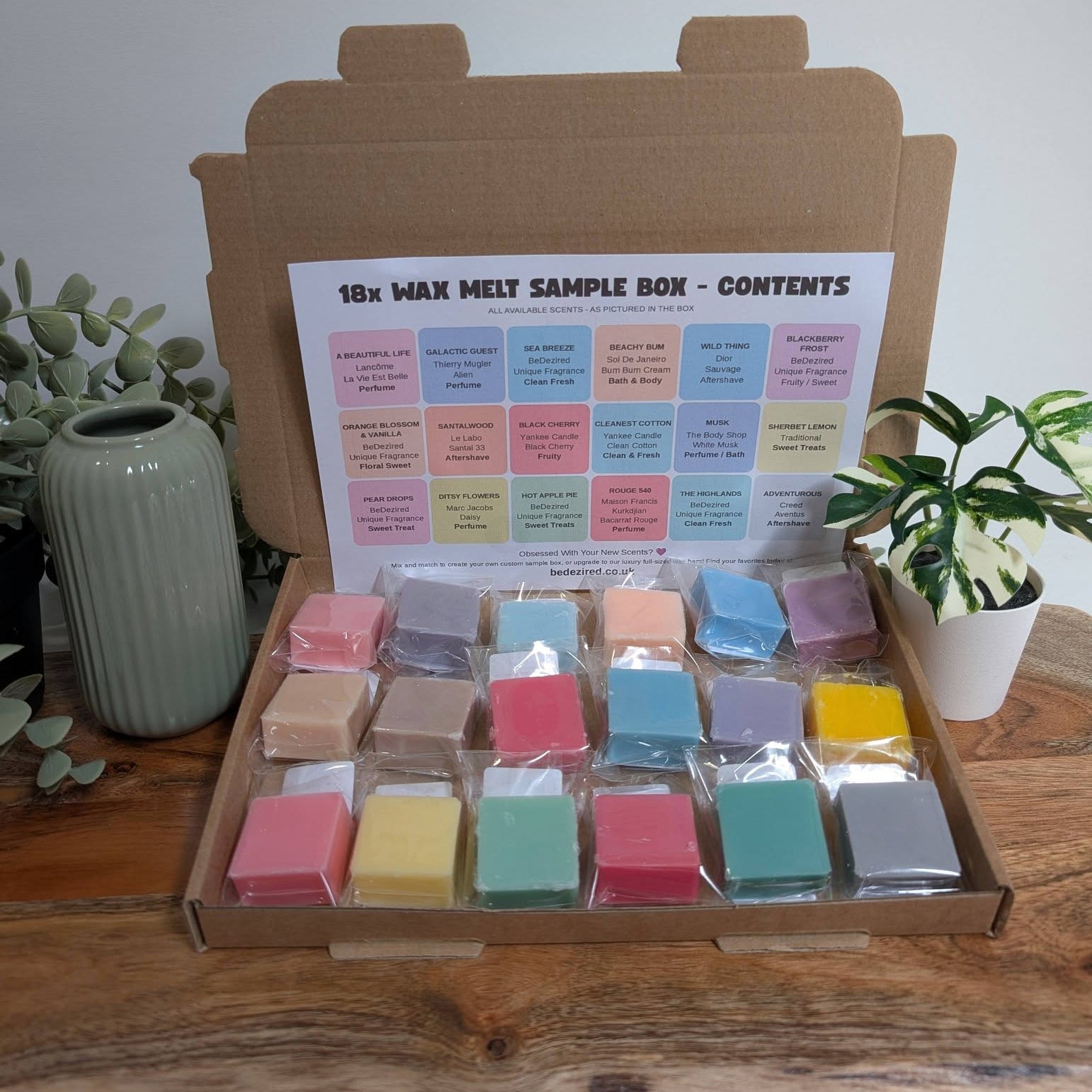 a brown postal box of wax melts containing 18 different fragrances, designer, clean, fresh out doors, fruity & Floral fragrances there's something for everyone. The perfect gift for someone special. 
