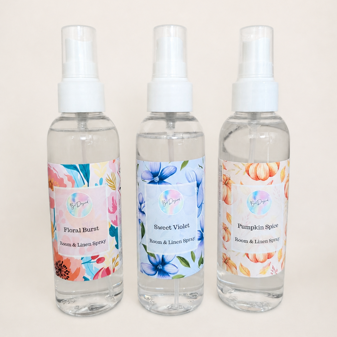 Three room & linen spray bottles with floral labels on a light background - 50% off Designer inspired fragrance SALE ends 5th May 2026